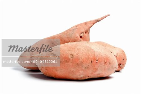 Three sweet potatoes isolated on white background