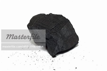 Bit of charcoal isolated on white with crums around