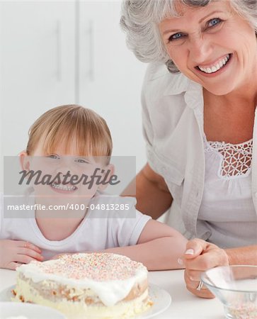 Lovely girl and her grandmother looking at the camera