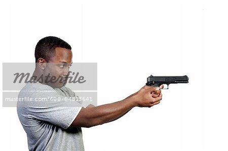 A black African American police detective man on the job with a gun