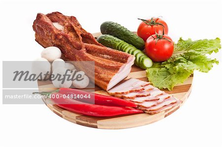sausage on plate with vegetables isolated on white