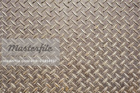 Background of old metal diamond plate in brown color.