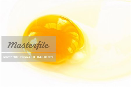 yolk from broken eggs photographed on a light background