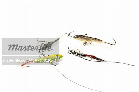 Four Fishing baits on a white background