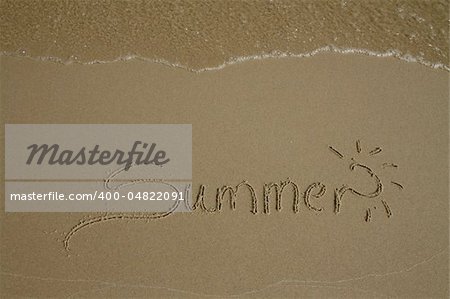 Summer written on sand with water wave