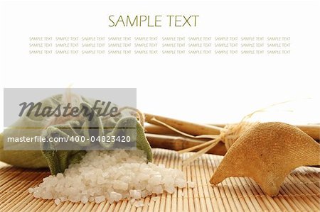 Facilities for body care in a fabric bag of bath salts, related to bamboo sticks, starfish. Isolated on white background