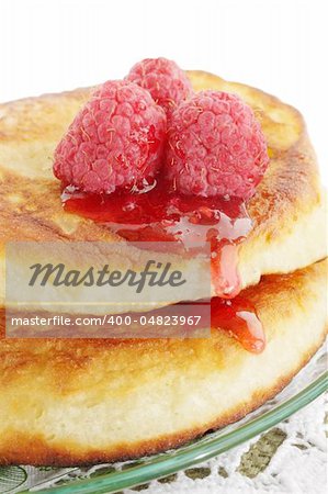 Pile of pancakes with the raspberry-colored jam