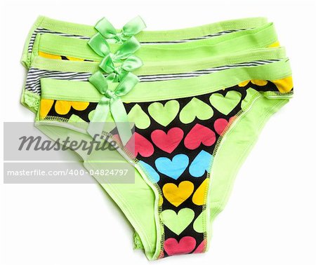 Four green feminine panties with pattern in the manner of heart on white background