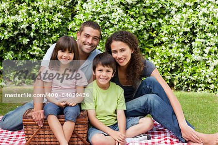 Family picnicking in the garden