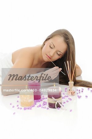 Aromatherapy.Beautiful woman with pure healthy skin and long hair in spa salon relaxing. isolated on white background