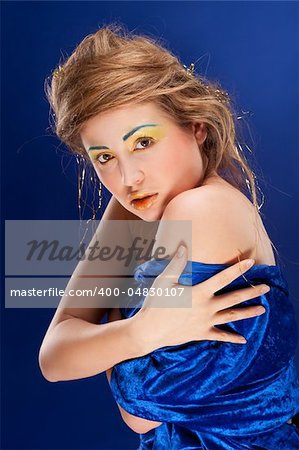 woman with glamour make-up on blue background