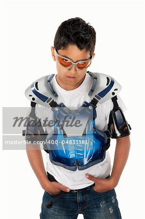 Serious Latino youngster in motorcross gear and hands in pockets