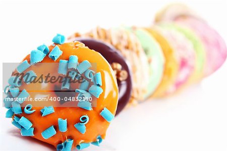 Colorful and tasty donuts on white background