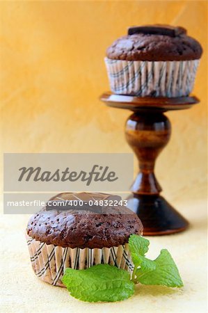 chocolate cupcake with chocolate decoration in pink packaging