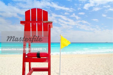 Baywatch red beach seat yellow wind flag in tropical caribbean sea