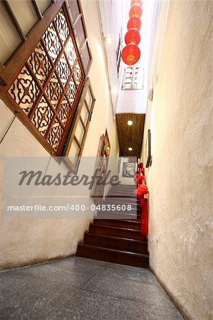 Chinese traditional corridor in wooden with red lantern.