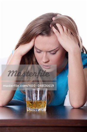 Young corpulent woman in depression, drinking alcohol