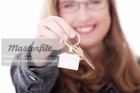 Young businesswoman (real estate agent) with house keys in hand