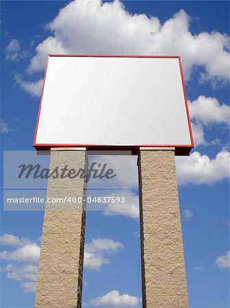 Store advertising sign in stone over cloudy sky, isolated with clipping path
