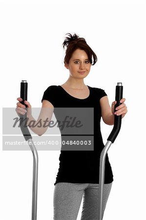 young woman exercising on stepping machine