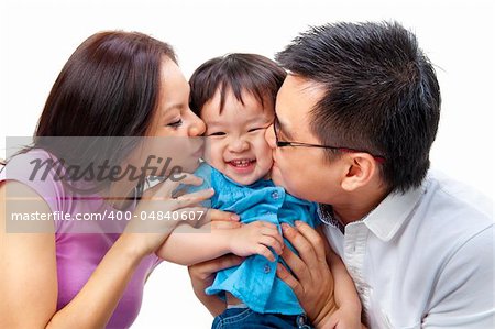 Parents giving their daughter a kiss attack.