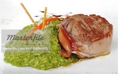 Beef meat wrapped in bacon and rice mixed with spinach (Selective Focus, Focus on Front)