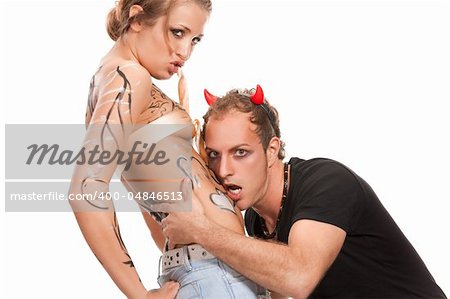 devil boy and  body-painted  beatiful blonde woman