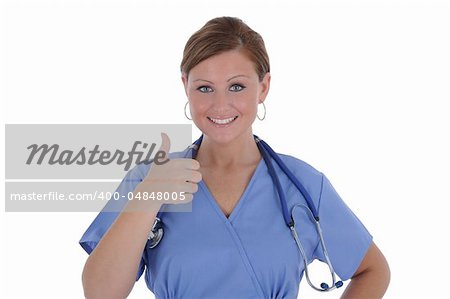 A attractive female nurse with a friendly smile displaying a thumb up, isolated on a solid white background.