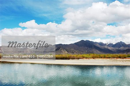 Landscape of river and mountains in a sunny day