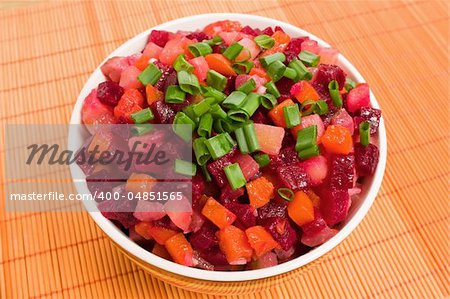 Vinaigrette Russian salad of beetroot, carrot, potato, green leek and olive oil