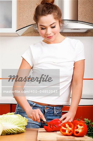 beautiful caucasian woman in the kitchen.