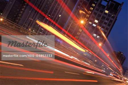 City night scene with car motion blurred in Taipei, Taiwan, Asia.