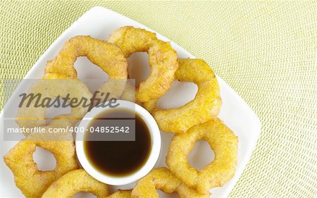 Popular Peruvian dessert called Picarones made from squash and sweet potato and served with chancaca syrup (kind of honey)