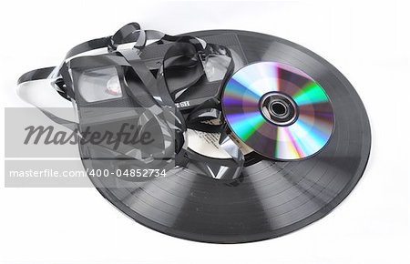 Picture of videokaseta of voice plate and compact disk disk on a white background