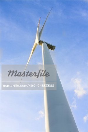 wind turbine generating electricity on blue sky