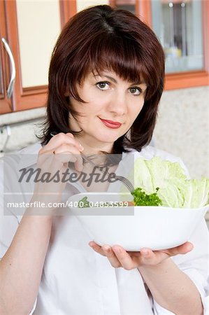 Beautiful a woman  to taste  cooked the food