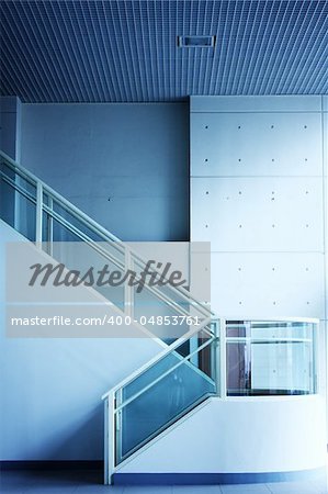 Modern interior of hall with stair with blue toned