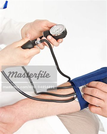 Nurse measuring the blood pressure
