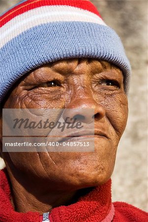 Old African woman against a grunge background