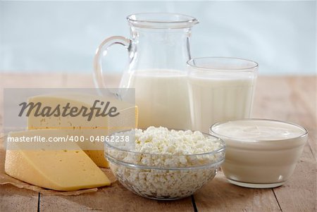 fresh dairy products on old wooden table