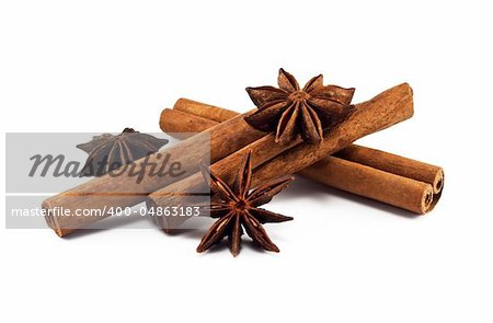 Cinnamon sticks and anise stars on white background