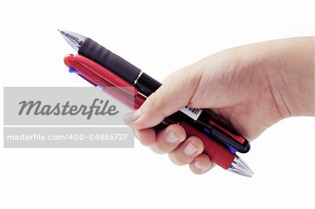 child's hand holding mechanical pen and pencil on white background