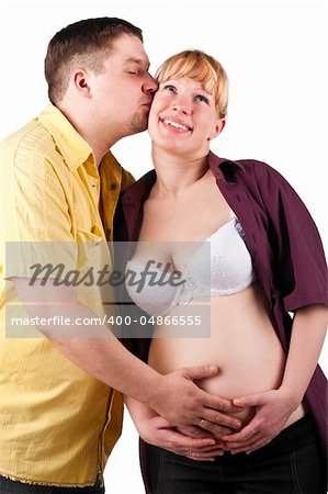 young husband is kissing his pregnant wife
