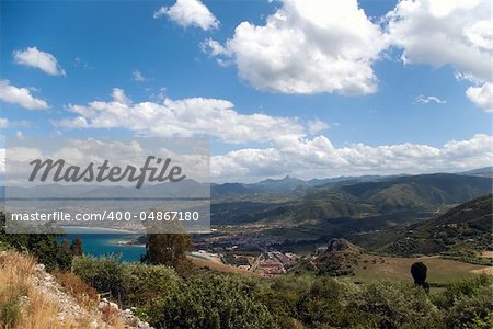 Tindari beach and waterfront, small village beneath mountains, Sicily, Italy