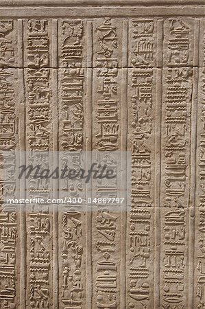 Egyptian hieroglyphic carvings on a wall at the Temple of Kom Ombo