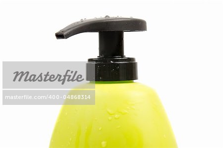 Close up of green shampoo bottle cap. Isolated on white background