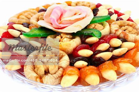 Dried fruits in plate isolated on white background.