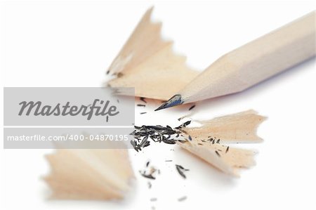 White pencil and its peelings on a white background