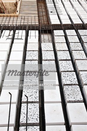 Technical detail of building operations: floor. Materials: polystyrene, steel bars, concrete