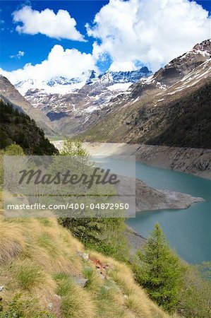 Spring Idyllic Alps landscape view, with mountains lake in Italy